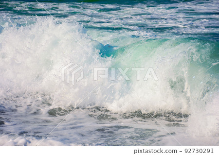 wave rushing in the shore. nature background at the sea in evening light. summer vacation concept wave rushing in the shore. nature background at the sea in evening light. summer vacation concept 92730291