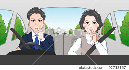 A man and a woman riding in a car A man and a woman riding in a car 92732167
