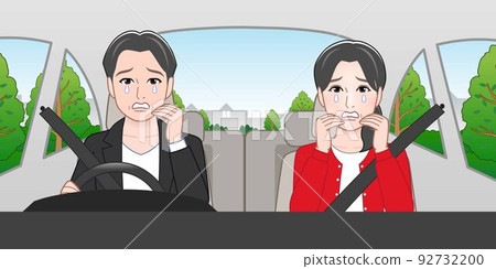 A man and a woman riding in a car A man and a woman riding in a car 92732200