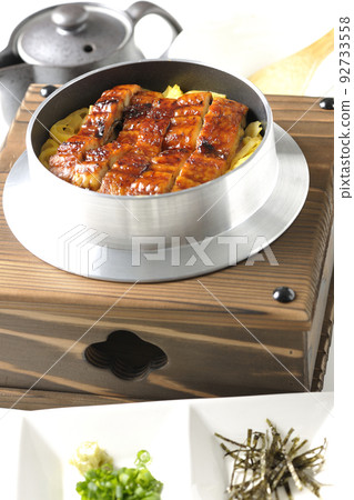 Kamameshi with kabayaki eel and dashi chazuke set, photographed against a white background 92733558