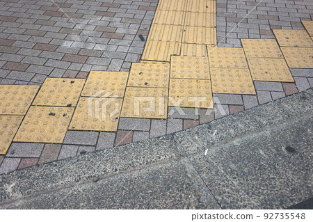 In the summer, under the scorching sun, the city, Braille blocks and sidewalks In the summer, under the scorching sun, the city, Braille blocks and sidewalks 92735548