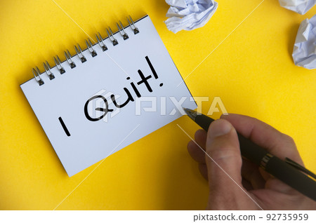 I quit text on white notepad on yellow cover background. Employment and resignation I quit text on white notepad on yellow cover background. Employment and resignation 92735959
