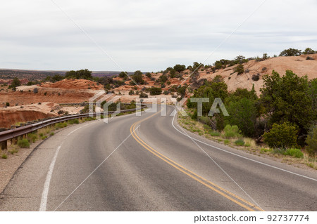 Scenic Road surrounded by Red Rock Mountains in the Desert. Scenic Road surrounded by Red Rock Mountains in the Desert. 92737774