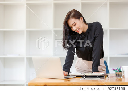 Lifestyle concept, Beautiful asian woman feel relaxing while studying online in coffee shop 92738166