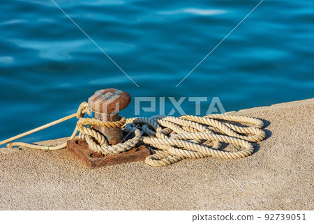 Rusty Mooring Bollard with Ropes in the Port - La Spezia Italy Rusty Mooring Bollard with Ropes in the Port - La Spezia Italy 92739051