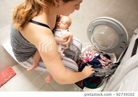 Performing role of good mother and perfect housewife 92739102