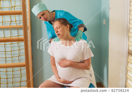 Woman gives birth at hospital, have a contraction 92739224