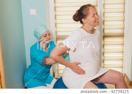 Woman gives birth at hospital, have a contraction 92739225