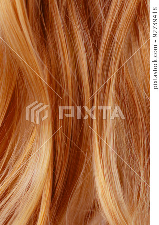 Red curly hair texture closeup. Red hair background. 92739418