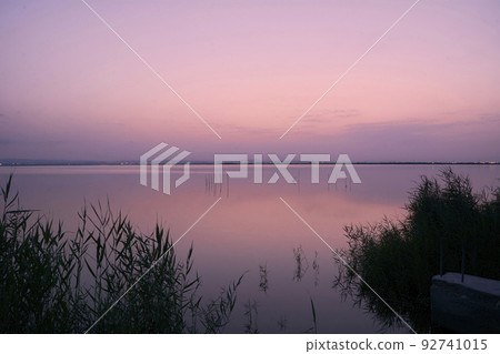 Sunset on the great lake, from the reeds, 92741015