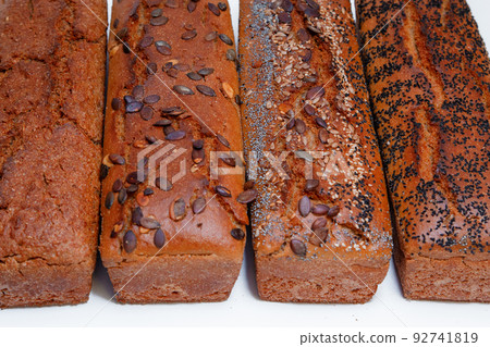 Dietary whole grain bread. Fresh bread is cooled. Dietary whole grain bread. Fresh bread is cooled. 92741819