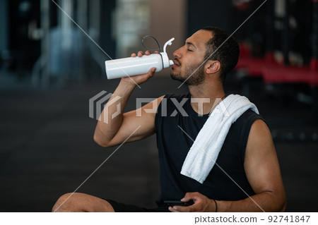 Workout Break. Sporty Young Black Man Drinking Water After Exercising At Gym 92741847