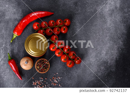Spicy sweet tomato sauce with garlic, pepper and herbs in a glass jars 92742137
