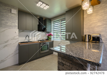 Interior of modern trendy grey kitchen 92742478