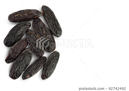 Tonka bean isolated on white background. Bean of Dipteryx odorata. Top view with copy space for your text. Flat lay Tonka bean isolated on white background. Bean of Dipteryx odorata. Top view with copy space for your text. Flat lay 92742492