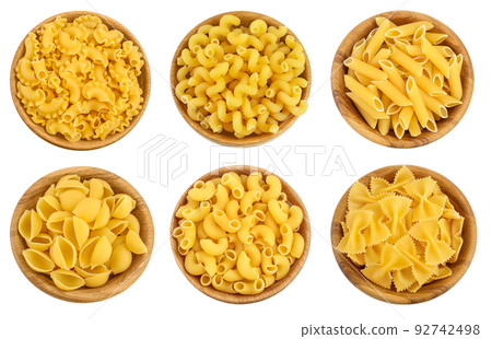 Uncooked dried conchiglie in bowl. Raw organic shell pasta isolated on white bachground with clipping path and full depth of field. Top view. Flat lay Uncooked dried conchiglie in bowl. Raw organic shell pasta isolated on white bachground with clipping path and full depth of field. Top view. Flat lay 92742498