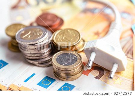 Energy savings concept with power plug and euro money Energy savings concept with power plug and euro money 92742577