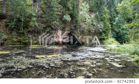 Mirror cliffs and an old river channel in a very beautiful forest in Cirulu nature trails, Latvia. 92742991