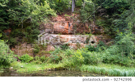 Mirror cliffs and an old river channel in a very beautiful forest in Cirulu nature trails, Latvia 92742996
