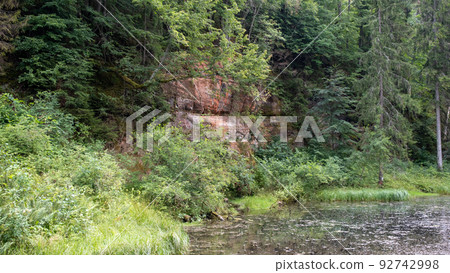Mirror cliffs and an old river channel in a very beautiful forest in Cirulu nature trails, Latvia. 92742998