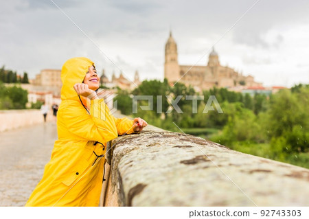 Salamanca Unesco Spain castile and leon. venezuelan latin tourism travel with oilskin under rain Salamanca Unesco Spain castile and leon. venezuelan latin tourism travel with oilskin under rain 92743303