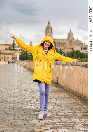 Salamanca Unesco Spain castile and leon. venezuelan latin tourism travel with oilskin under rain 92743304