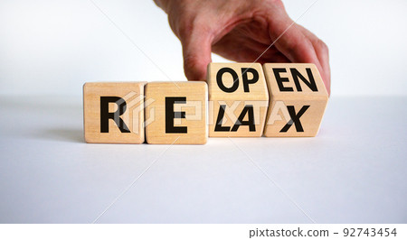 Relax and reopen symbol. Businessman turns cubes and changes the word 'relax' to 'reopen'. Beautiful white table, white background. Business, relax and reopen concept. Copy space. Relax and reopen symbol. Businessman turns cubes and changes the word 'relax' to 'reopen'. Beautiful white table, white background. Business, relax and reopen concept. Copy space. 92743454