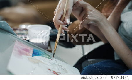 Woman with a disability using watercolor Woman with a disability using watercolor 92743485
