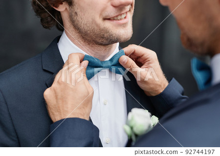 Fixing Bowtie Closeup 92744197