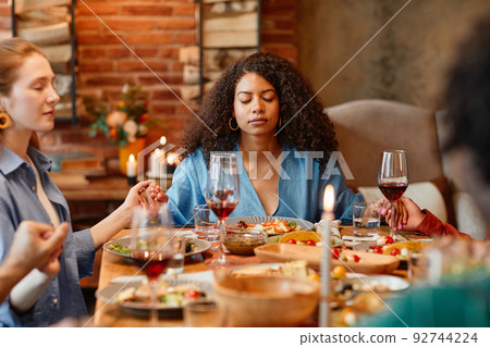 Saying Grace at Dinner Party Saying Grace at Dinner Party 92744224