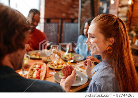 Young Woman at Dinner Party 92744265