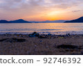 Watch the gentle waves of the Seto Inland Sea and the sunset 92746392