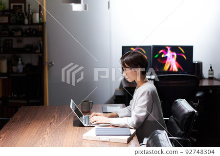 woman working late woman working late 92748304