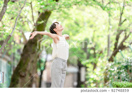 Woman stretching deep breathing exercise fresh green 92748859