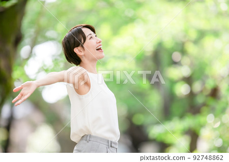 Woman stretching deep breathing exercise fresh green 92748862