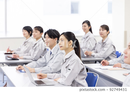 Business person wearing work clothes to receive training Business person wearing work clothes to receive training 92749431