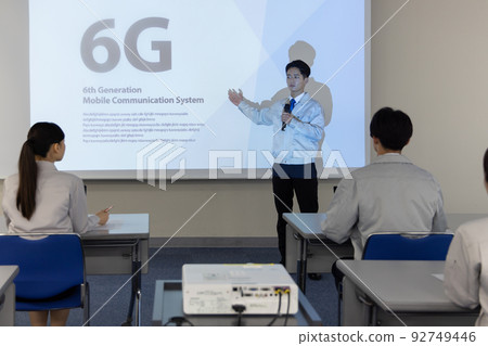 Business person taking a seminar on next-generation 6G Business person taking a seminar on next-generation 6G 92749446