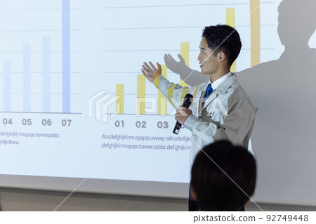 businessman giving a presentation businessman giving a presentation 92749448