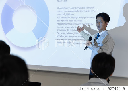 businessman giving a presentation businessman giving a presentation 92749449