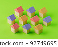 House of building blocks, isometric drawing, green background 92749695
