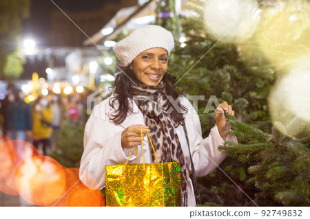 Latin woman at christmas fair 92749832