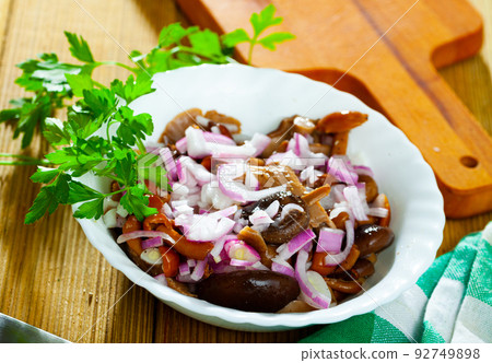 Marinated assorted mushrooms with red onion and greens Marinated assorted mushrooms with red onion and greens 92749898