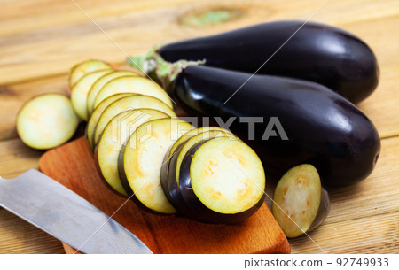 Fresh eggplants with chopped slices 92749933