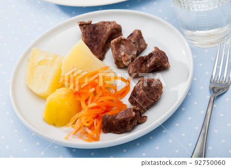 Steamed veal with potatoes and carrots. Steamed veal with potatoes and carrots. 92750060