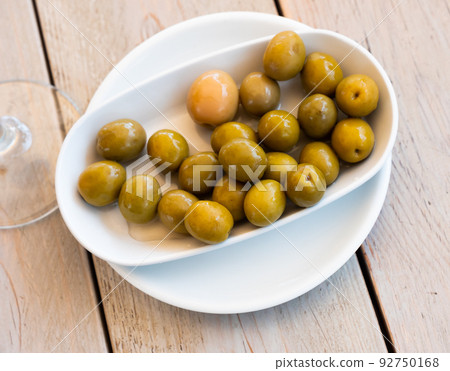 Pickled green olives with a stone 92750168