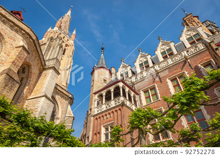Church of our lady bell tower in Bruges at blue sky, Belgium Church of our lady bell tower in Bruges at blue sky, Belgium 92752278