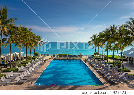 Tropical paradise: beach with pool, gazebos and palm trees, Montego Bay, Jamaica 92752304