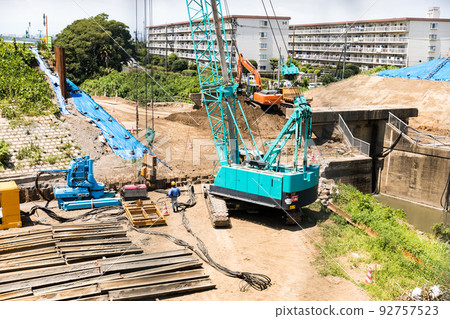 Iruma River, Saitama Prefecture, Reconstruction work for the canal, Heavy machinery crawler crane 92757523