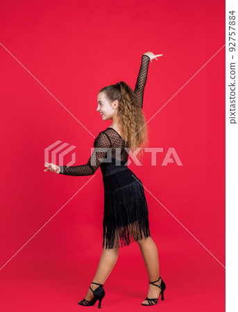 child girl elegant ballroom dancer wear black dress in dance pose, professional dancer child girl elegant ballroom dancer wear black dress in dance pose, professional dancer 92757884