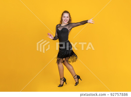 girl kid cute ballroom dancer wear black dress in dance pose, dancing girl kid cute ballroom dancer wear black dress in dance pose, dancing 92757886